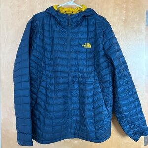 The NorthFace ThermoBall Hoodie in blue with yellow lining.  Size XL.